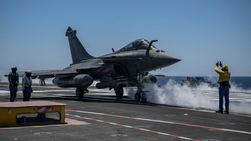 A rafale fighter jet prepares for take off on the deck of the French aircraft carrier Charles de Gaulle during the NATO military exercise Neptune Strike 26-2, off the coast of the Greek island of Crete, on April 27, 2026. 
