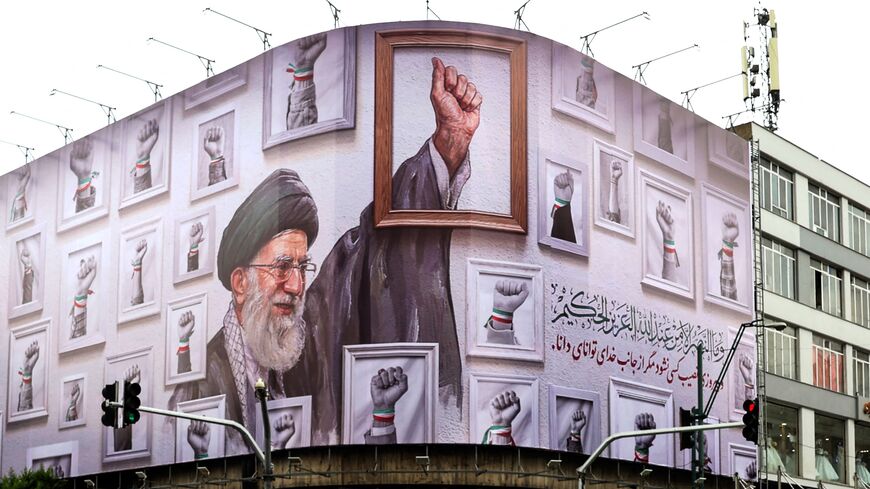 A billboard with the image of the late Iranian supreme leader Ayatollah Ali Khamenei wraps the front of a building in Tehran on May 5, 2026. 