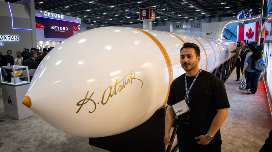 ISTANBUL, TURKEY - MAY 06: A man poses for a photograph in front of the newly unveiled, Turkish made intercontinental ballistic missile Yildirimhan at the SAHA International Defence and Aerospace Expo on May 06, 2026 in Istanbul, Turkey. The International Defence and Aerospace Exhibition, showcased Turkish and foreign companies new products and technology. The expo was dominated by UAV products as modern warfare increasingly shifts to drone and unmanned technologies. (Photo by Chris McGrath/Getty Images)