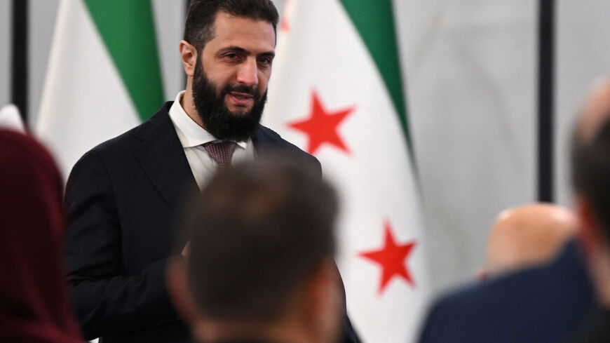 Syrian President Ahmed al-Sharaa arrives to attend the second day of the first Syrian-Emirati (United Arab Emirates) Investment Forum, at the People's Palace in Damascus on May 12, 2026. (Photo by LOUAI BESHARA / AFP via Getty Images)