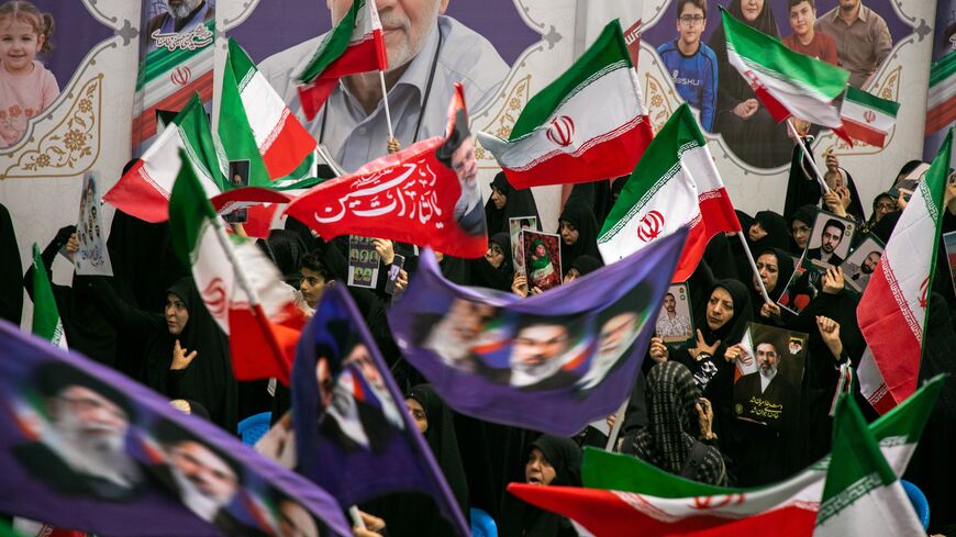 People hold portraits of the dead at the Imam Khomeini Mosalla Mosque to commemorate those killed in the current US-Israeli war as well as previous wars on May 24, 2026, in Tehran, Iran.