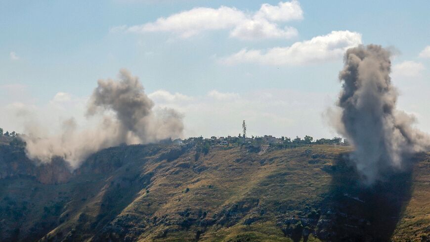 A photograph taken from the Marjayoun area in southern Lebanon shows smoke rising after an Israeli air strike on the village of Arnoun on May 30