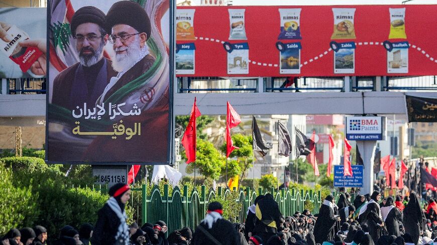A billboard in Beirut depicts slain Ayatollah Ali Khamenei and his son, Mojtaba Khamenei