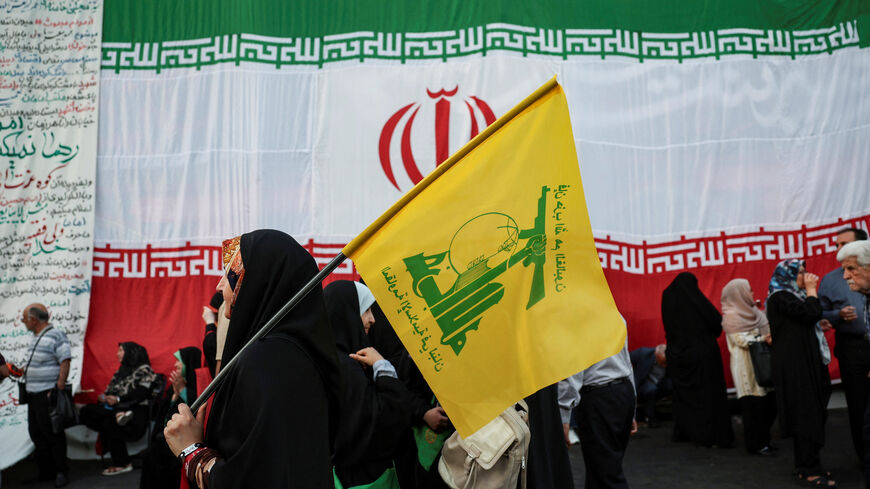 A woman holds a Hezbollah flag during a rally in support of Iran's Supreme Leader, Mojtaba Khamenei, in Tehran, Iran, June 4, 2026. Majid Asgaripour/WANA (West Asia News Agency) via REUTERS