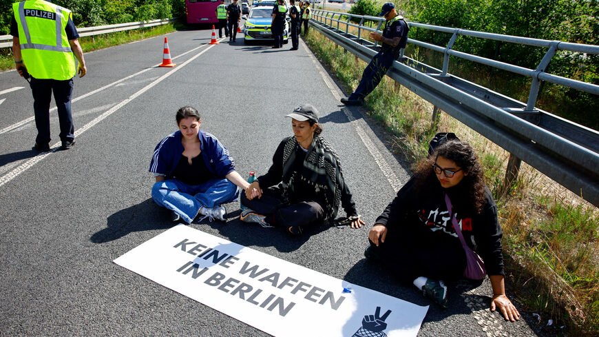 Activists block a road to the venue during protest on the opening day of the International Aerospace Exhibition ILA at Schoenefeld Airport in Berlin, Germany, June 10, 2026. REUTERS/Axel Schmidt