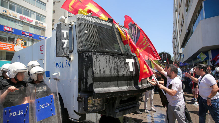 Supporters of Ozgur Ozel, the ousted chairman of the main opposition Republican People’s Party (CHP), clash with riot police during a rally while waiting for his arrival in Izmir, Turkey, May 26, 2026. REUTERS/Berkcan Zengin