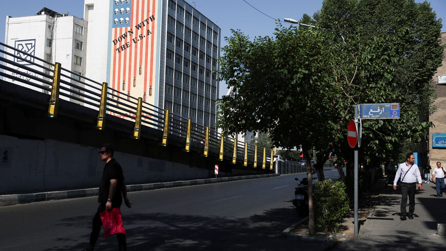 A man walks near an anti-U.S. mural on a building in Tehran, Iran, June 11, 2026. Majid Asgaripour/WANA (West Asia News Agency) via REUTERS