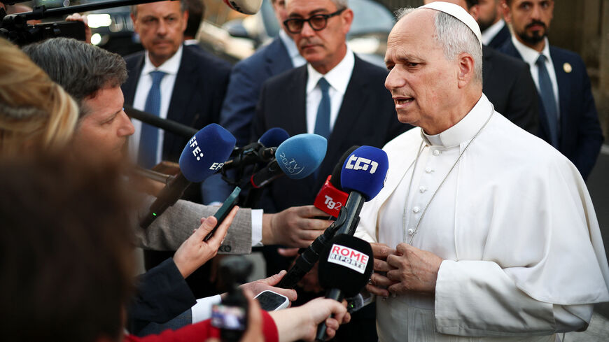 Pope Leo XIV speaks to journalists as he leaves the papal residence to head back to the Vatican, in Castel Gandolfo, Italy, June 16, 2026. REUTERS/Guglielmo Mangiapane