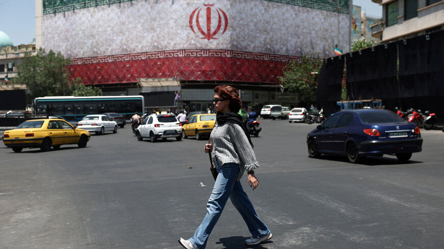 A woman walks on a street in Tehran, Iran, June 14, 2026. Majid Asgaripour/WANA (West Asia News Agency) via REUTERS
