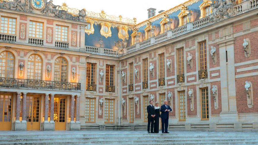 FILE PHOTO: President of France Emmanuel Macron, his wife Brigitte Macron and U.S. President Donald Trump pose for a photo outside Chateau de Versailles, France, June 17, 2026. Anna Moneymaker/Pool via REUTERS/File Photo