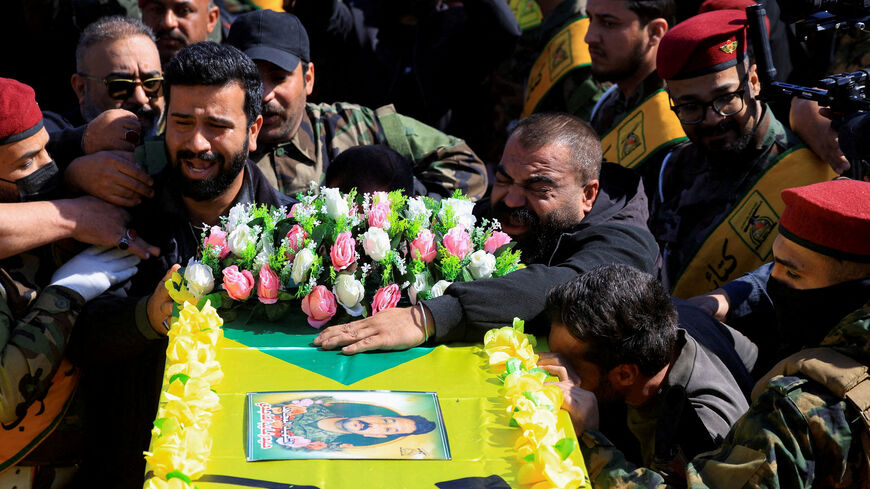 FILE PHOTO: Mourners attend the funeral procession of Ali Hassan Abdullah, a commander from Islamic Resistance in Iraq, and people who were accompanying him and were killed in an airstrike that targeted their vehicle south of Baghdad, according to police sources, in Baghdad, Iraq, March 5, 2026. REUTERS/Thaier Al-Sudani/File Photo