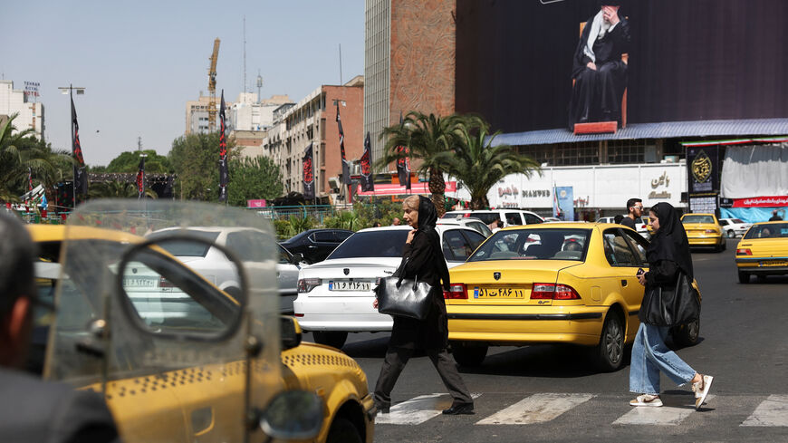 People walk past a billboard with a picture of the Iran's late Supreme Leader Ayatollah Ali Khamenei, in Tehran, Iran, June 17, 2026. Majid Asgaripour/WANA (West Asia News Agency) via REUTERSRDA.
