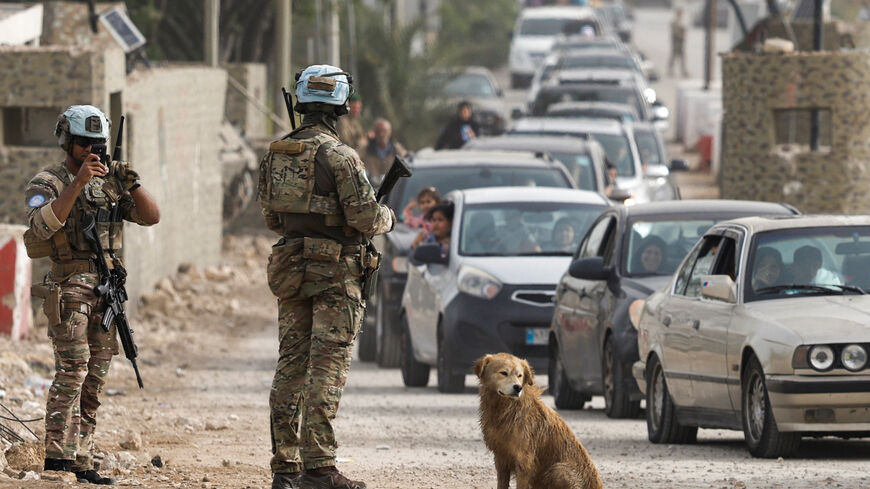 French UN peacekeepers stand near the bridge linking southern Lebanon to the rest of the country, in Qasmiyeh, Lebanon, April 18, 2026. REUTERS/Louisa Gouliamaki