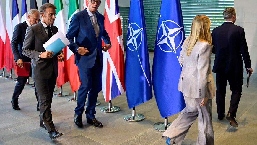 Poland's Prime Minister Donald Tusk, France's President Emmanuel Macron, German Chancellor Friedrich Merz, Italy's Prime Minister Giorgia Meloni and Britain's Prime Minister Keir Starmer leave after addressing the press at the end of their meeting of state leaders of the European Group of Five (E5)at the Chancellery in Berlin, Germany, June 24, 2026.   JOHN MACDOUGALL/Pool via REUTERS