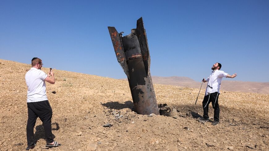 Iran fired some 30 missiles at Israel, some landing in the occupied territories