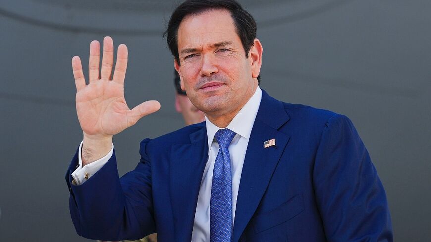 Secretary of State Marco Rubio waves as he boards a US Air Force transport aircraft in Manama, Bahrain on June 25, 2026