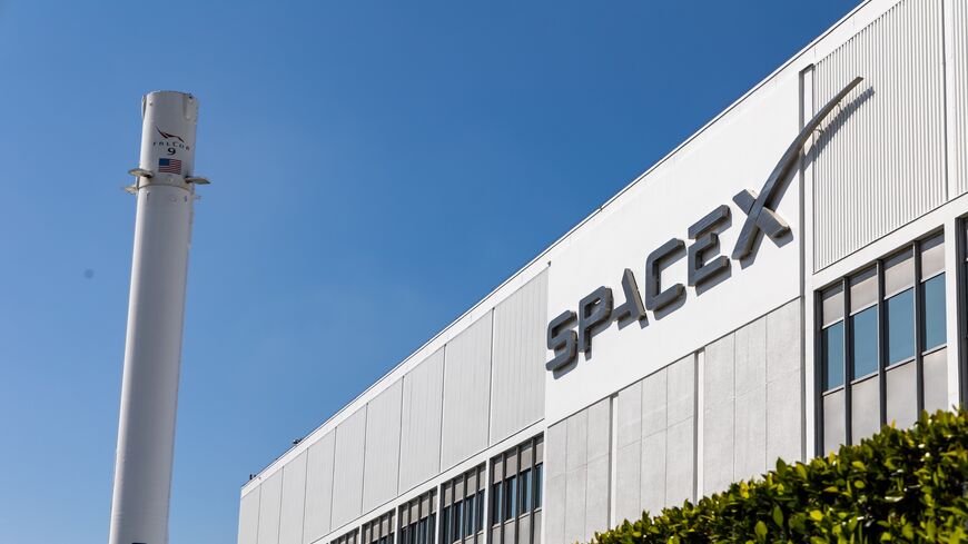The headquarters of SpaceX in Hawthorne, California, with a Falcon 9 booster in March 2024.