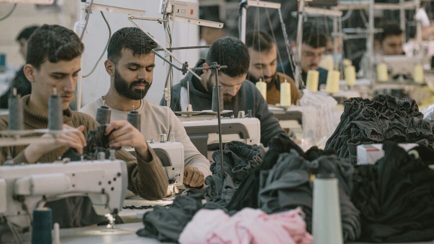 Syrian textile employees work in a textile workshop in Gaziantep, Turkey, on Jan. 30, 2025. 