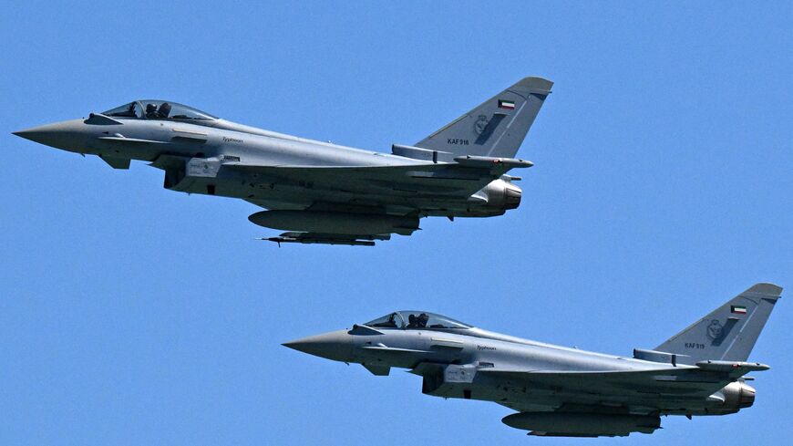 Kuwaiti Air Force Eurofighter Typhoon fighter aircraft fly over during an airshow commemorating Kuwait's 64th Independence Day in Kuwait City on Feb. 25, 2025. 