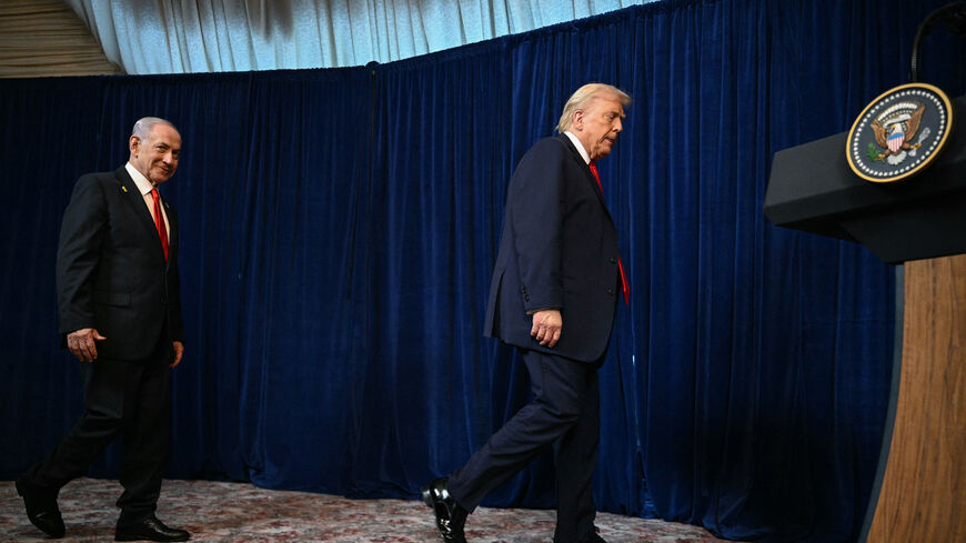 US President Donald Trump and Israeli Prime Minister Benjamin Netanyahu arrive to speak to journalists during a joint press conference at Trump's Mar-a-Lago residence in Palm Beach, Florida, on December 29, 2025. US President Donald Trump hosted Israeli Prime Minister Benjamin Netanyahu in Florida on December 29 for crucial talks on moving to the next stage of the fragile Gaza truce plan.The two leaders also discussed Iran, with Trump saying that if Tehran rebuilt its nuclear facilities the United States wo