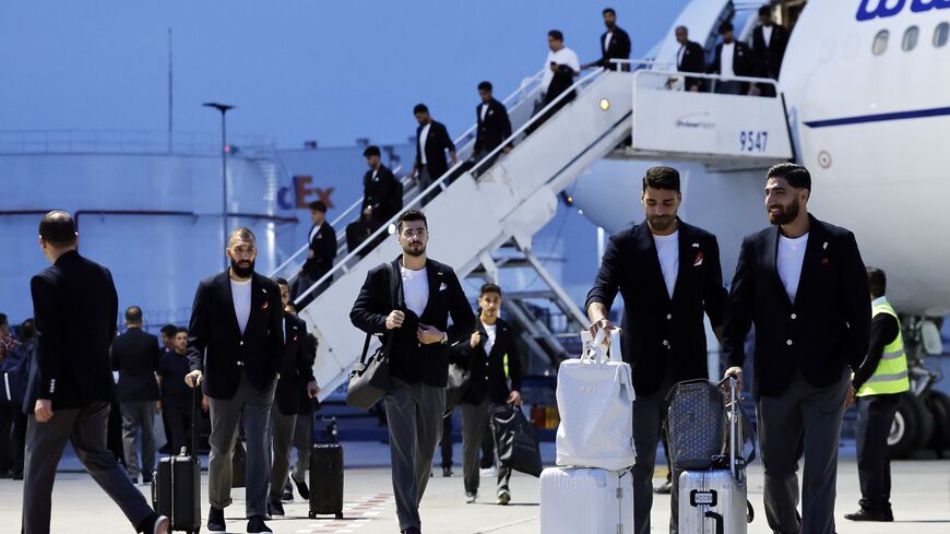Members of the Iranian national soccer team including midfielder Alireza Jahanbakhsh (R) arrive at Tijuana International Airport on June 7, 2026, in Tijuana, Mexico. 