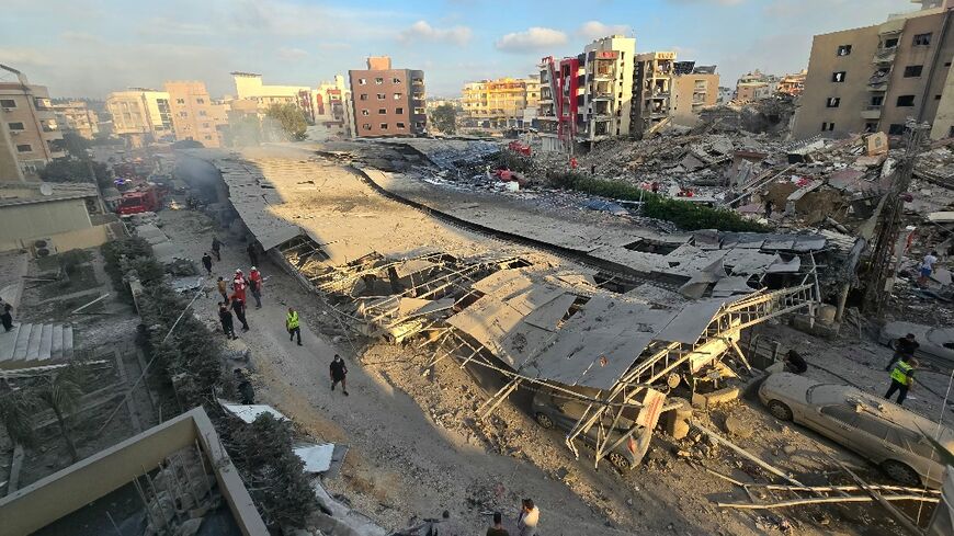 First responders gather at the site of the hospital car park after an Israeli strike hit nearby