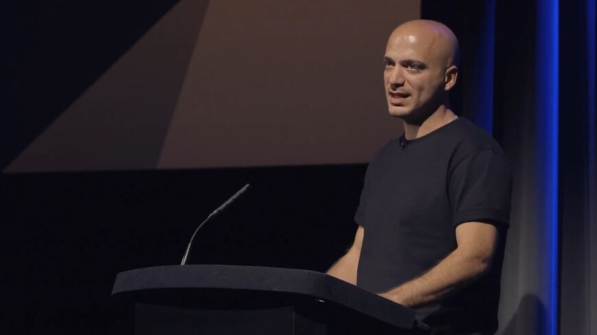  Hassan Akkad speaks about fleeing Syria in 2015 and his work as a filmmaker at a BAFTA event, Sept. 2023.