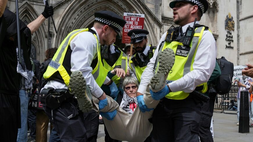Police remove protesters from outside the Royal Courts Of Justice in central London in June