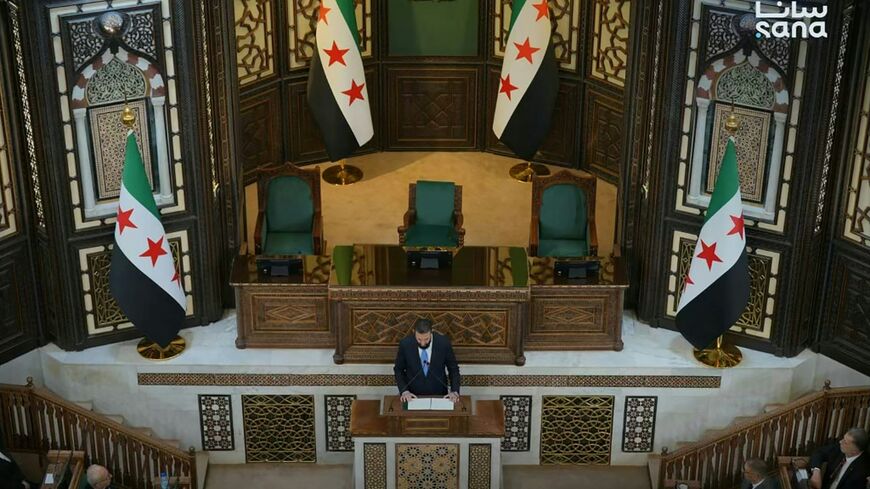 This handout picture taken and released by the official Syrian Arab News Agency shows Syria's President Ahmed al-Sharaa speaking during the first meeting of the transitional parliament in Damascus