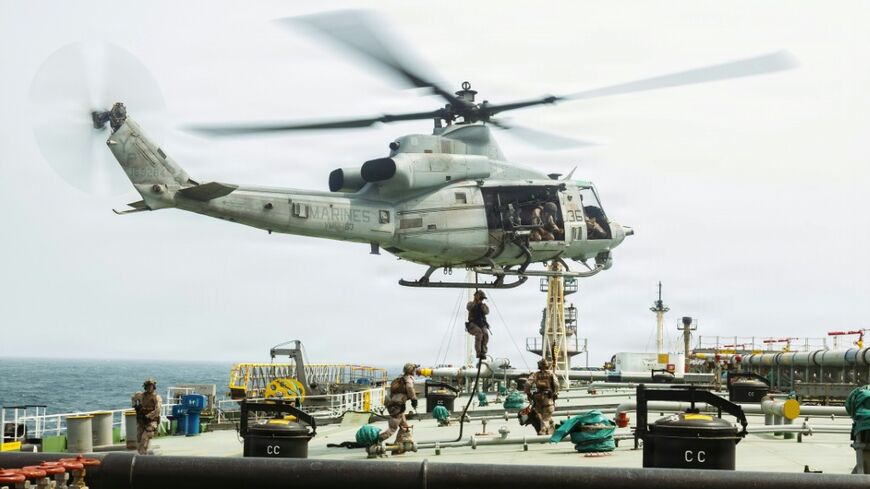 This US Marine Corps handout photograph taken on July 16, 2026, by US Central Command Public Affairs reportedly shows US Marines from the 11th Marine Expeditionary Unit conducting a verification boarding aboard M/T Wen Yao in the Gulf of Oman.