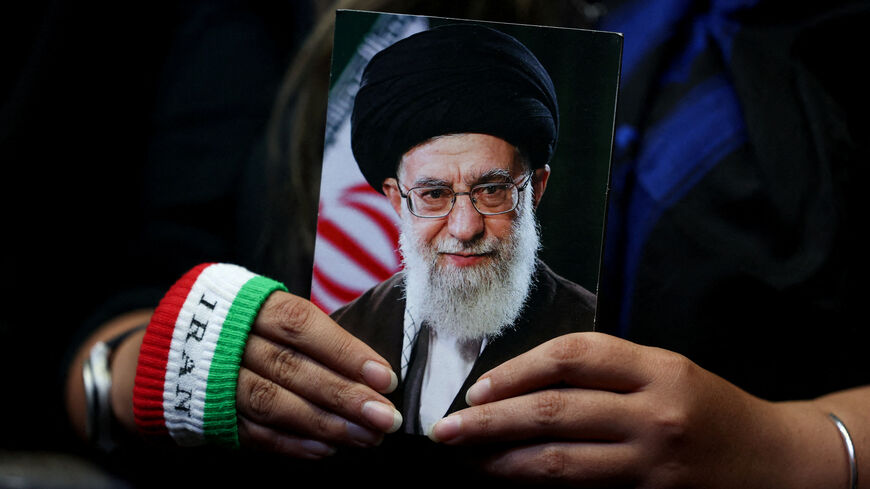FILE PHOTO: A woman holds an image of late Iranian Supreme Leader Ayatollah Ali Khamenei during a rally in Tehran, Iran, May 29, 2026. Majid Asgaripour/WANA (West Asia News Agency) via REUTERS
/File Photo