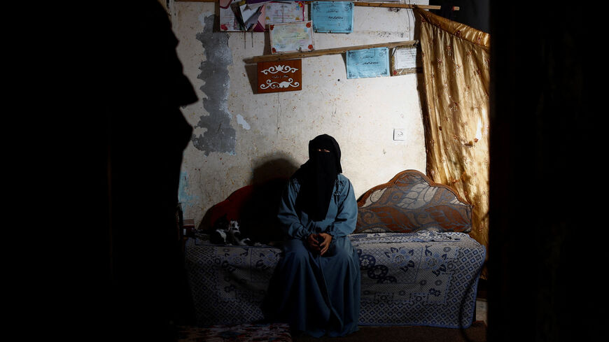 Rana Abu Nassar, mother of Palestinian prisoner Osama Abu Nassar who is held by Israel, sits inside her home in Al-Maghazi refugee camp, central Gaza Strip, July 3, 2026. REUTERS/Mahmoud Issa