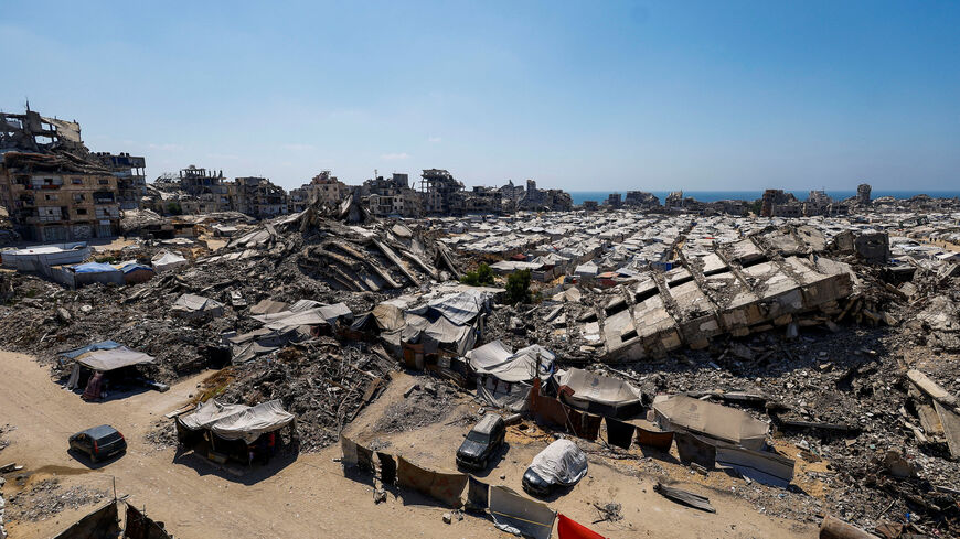 A general view of the rubble of residential buildings destroyed during the Israeli offensive and tents sheltering displaced Palestinians in Gaza City, July 4, 2026. REUTERS/Mahmoud Issa