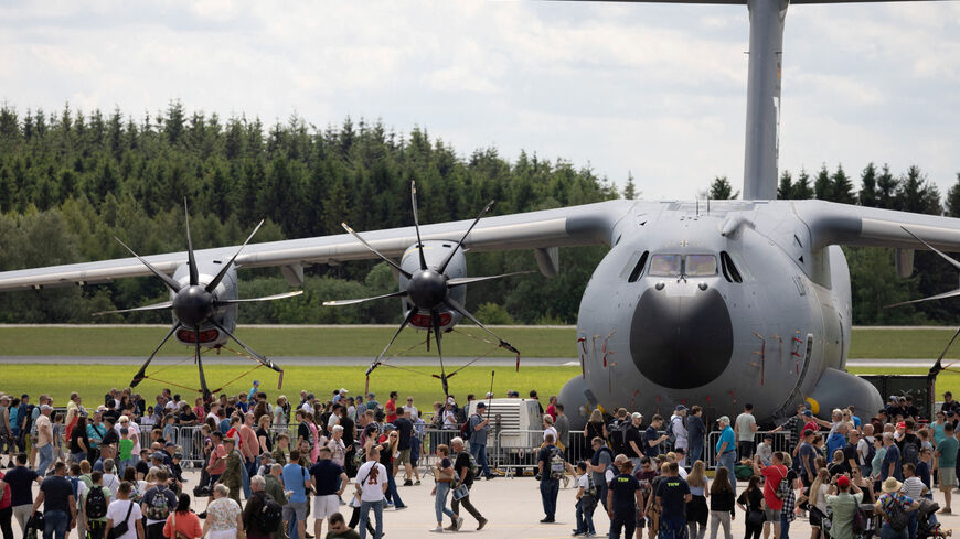 Visitors walk in front of a Airbus A400M during the "Tag der Bundeswehr", where the German armed forces Bundeswehr open their doors to the public, in Laage, northeastern Germany, June 6, 2026. REUTERS/Axel Schmidt