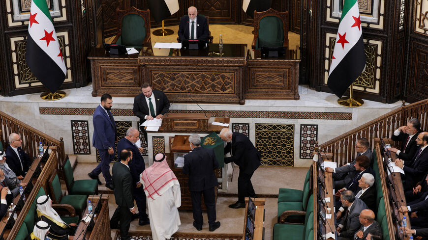 Members of Syria's newly formed People's Assembly attend the body's inaugural session, the first parliament session since the end of the rule of ousted Syrian President Bashar al-Assad, in Damascus, Syria, July 12, 2026. REUTERS/Khalil Ashawi