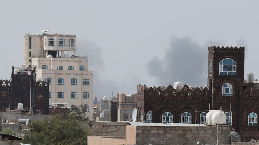 Smoke rises after reports of an airstrike hitting near the Sanaa International Airport, as seen from Sanaa, Yemen, July 13, 2026. REUTERS/Khaled Abdullah