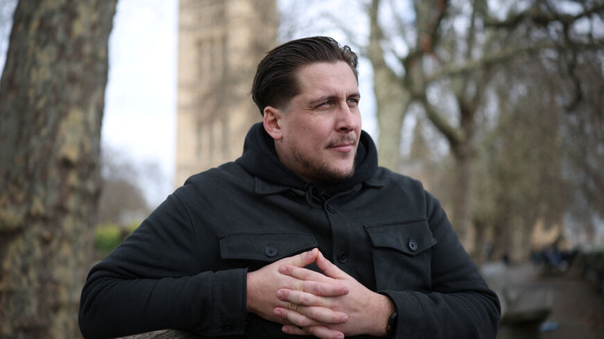 FILE PHOTO: Joe Bennett, son of British citizen Lindsay Foreman, who has been imprisoned in Iran and sentenced for 10 years with her husband Craig, following their arrest on espionage charges during a round-the-world motorcycle trip in January 2025, poses for a photograph during an interview with Reuters in London, Britain March 3, 2026. REUTERS/Isabel Infantes/File Photo