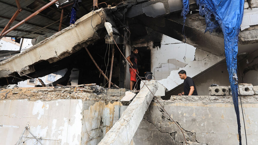 Palestinians inspect the site of an Israeli strike on a house in Gaza City, July 21, 2026. REUTERS/Dawoud Abu Alkas