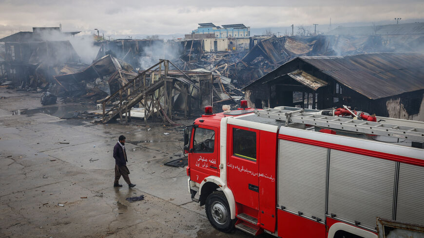 FILE PHOTO: An Afghan man walks next to the site where a drug rehabilitation center was destroyed in what the Taliban said was a Pakistani airstrike, in Kabul, Afghanistan, March 18, 2026. REUTERS/Sayed Hassib/File Photo