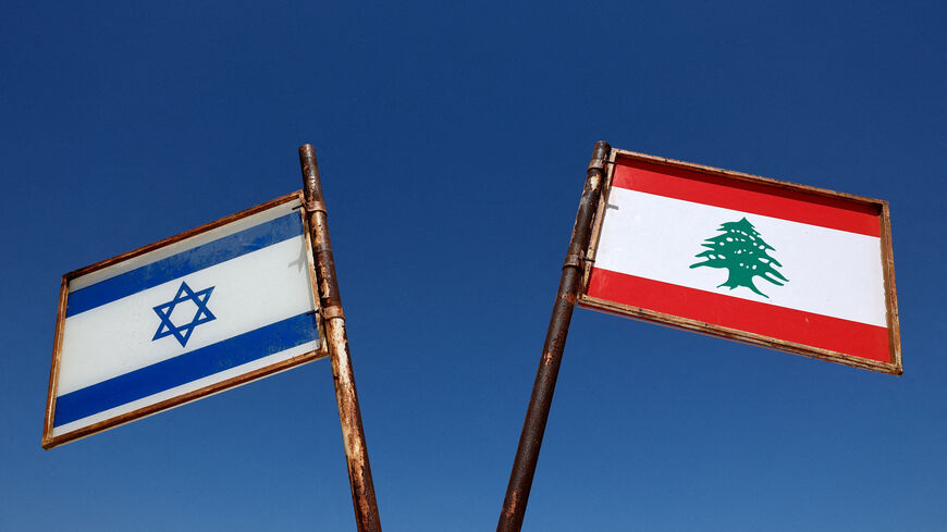 FILE PHOTO: Representations of the Israeli and Lebanese flags at a memorial near the Israel-Lebanon border, outside Metula, Israel, June 27, 2026, after Israel and Lebanon signed a framework agreement following U.S.-mediated talks. REUTERS/Amir Cohen/File Photo