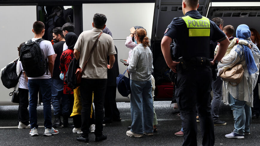 Afghan nationals board a bus as they arrived in Germany from Pakistan at Hannover Airport, after legal and diplomatic pressure pushed Germany to resume a scheme that allows the entry of vulnerable Afghans, in Hannover, Germany, September 1, 2025. REUTERS/Christian Mang