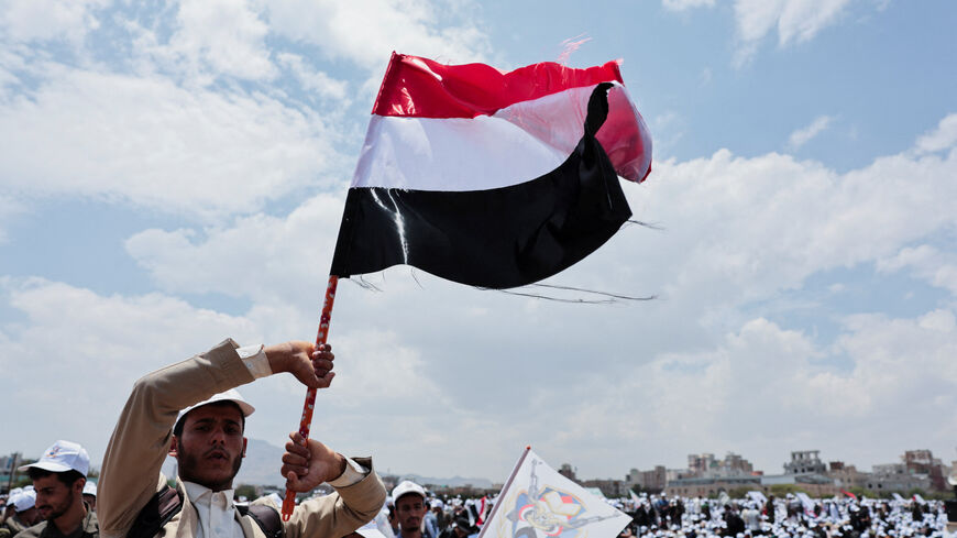 A student holds up a Yemeni flag during a parade at Sanaa University campus to show support for the Houthis amid an escalation with Saudi Arabia, in Sanaa, Yemen July 22, 2026. REUTERS/Khaled Abdullah