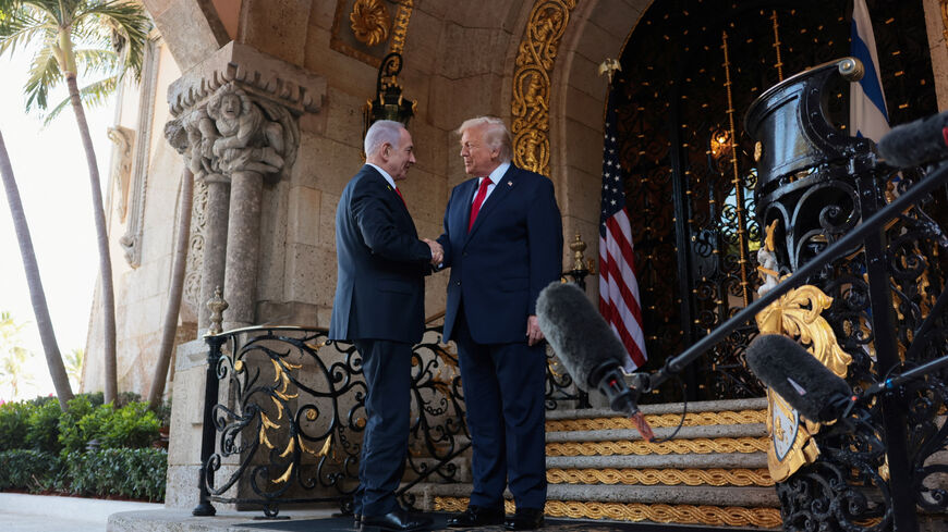 U.S. President Donald Trump greets Israeli Prime Minister Benjamin Netanyahu upon arrival for meetings at Trump's Mar-a-Lago club in Palm Beach, Florida, U.S., December 29, 2025. REUTERS/Jonathan Ernst