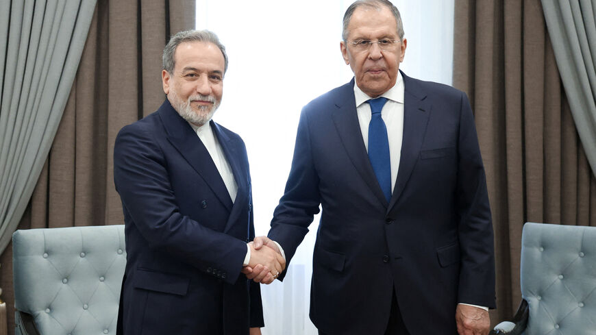 Russian Foreign Minister Sergei Lavrov shakes hands with Iranian Foreign Minister Abbas Araqchi during their talks on the sidelines of the Shanghai Cooperation Organisation (SCO) Council of Foreign Ministers meeting in Cholpon-Ata, Kyrgyzstan July 24, 2026. Russian Foreign Ministry/Handout via REUTERS ATTENTION EDITORS - THIS IMAGE WAS PROVIDED BY A THIRD PARTY. NO RESALES. NO ARCHIVES. MANDATORY CREDIT. REFILE - QUALITY REPEAT