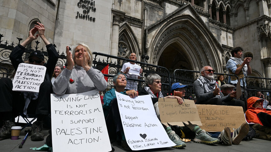 FILE PHOTO: People attend a demonstration opposing the government's decision to ban Palestine Action as a terror organisation, following a Court of Appeal ruling on the lawfulness of proscribing the pro-Palestinian group under terrorism laws, outside the Royal Courts of Justice, in London, Britain, June 15, 2026. REUTERS/Chris J. Ratcliffe/File Photo