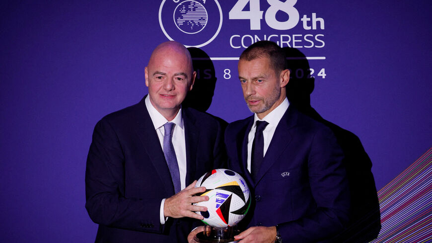 FILE PHOTO: Soccer Football - UEFA Congress - Maison de la Mutualite, Paris, France - February 8, 2024 FIFA president Gianni Infantino and UEFA president Aleksander Ceferin during the UEFA Congress REUTERS/Gonzalo Fuentes/File Photo
