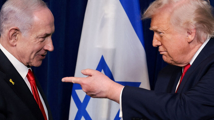 FILE PHOTO: U.S. President Donald Trump points his finger towards Israeli Prime Minister Benjamin Netanyahu during a press conference after meeting at Trump?s Mar-a-Lago club in Palm Beach, Florida, U.S., December 29, 2025. REUTERS/Jonathan Ernst/File Photo