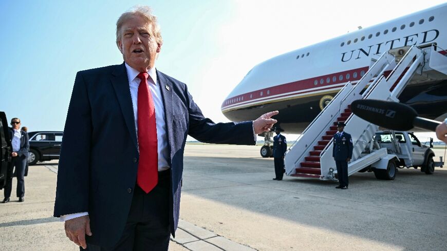 US President Donald Trump speaks to the press before he boards Air Force One for his first flight aboard the Boeing 747-8 that Qatar gifted the United States to use for executive travel