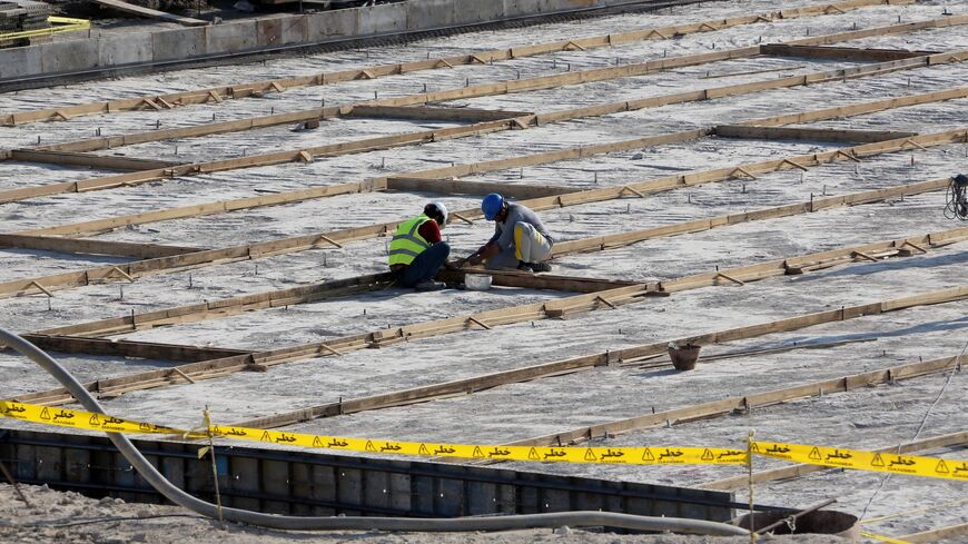 A picture taken on Nov. 10, 2019, shows workers on the construction site of a second reactor in Iran's Bushehr nuclear power plant, during an official ceremony to kick-start the works at the facility. 