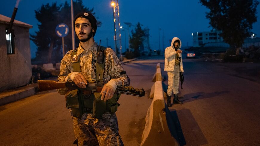 Volunteers of the Druze-led National Guard manage traffic at a checkpoint, Suwayda, Syria, Jan. 22, 2026.